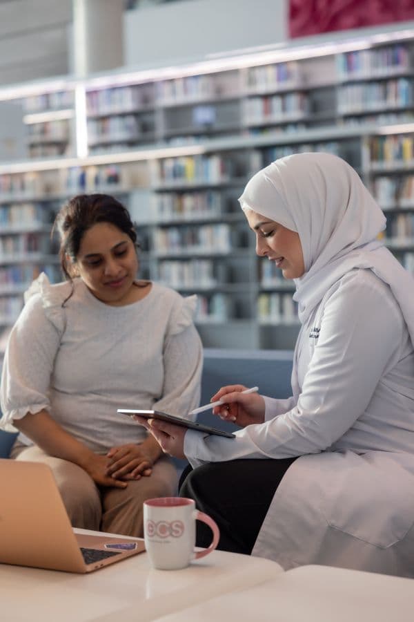 Sara with a patient during a genetic counseling session